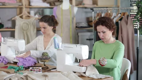 Two women tailor at work in cloth design shop. Stock Footage 341525805