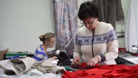 Two women tailors in the Studio working together Stock Footage 126975401