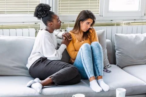 Two women talking about problems at home. Friendship consoling and care, unha Stock Photos