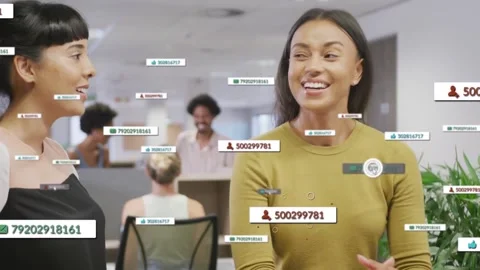 Two women talking in office while cursor clicking tags and circling numeric Stock Footage 332955896