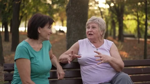 Two women talking in the park Stock Footage 255124752