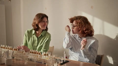 Two Women Testing and Creating Fragrance at Perfume Master Class Stock Footage 337108174