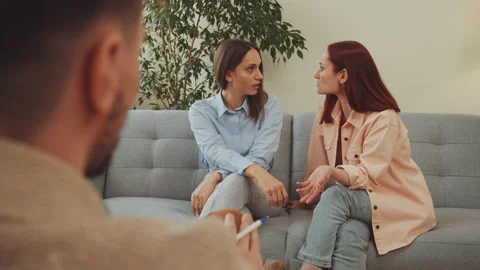Two Women at Therapy Session with Counselor Stock Footage 334183370