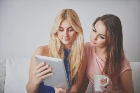 Two women using tablet Stock Photos