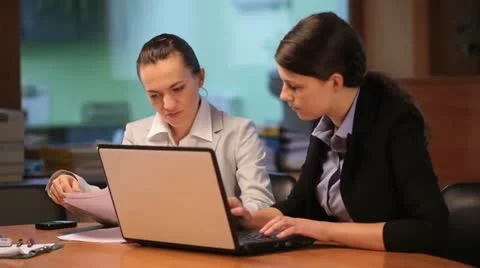 Two women working with computer Stock Footage 10888265