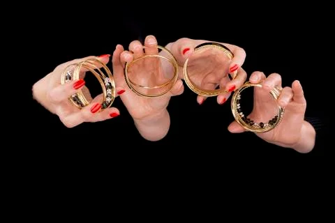 Two women's hands with bracelets Stock Photos
