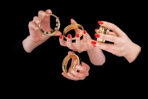 Two women's hands with bracelets Stock Photos