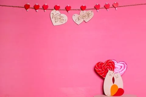 Two wooden hearts on a string Two red hearts on a clothespin on View from abo Stock Photos