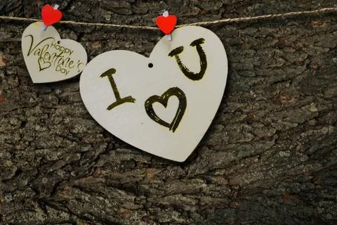 Two wooden hearts on a string Two red hearts on a clothespin on View from abo Stock Photos