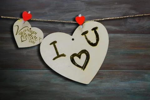 Two wooden hearts on a string Two red hearts on a clothespin on View from abo Stock Photos