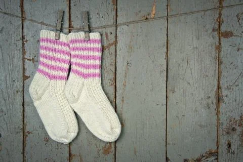 Two woolen socks hanging Stock Photos