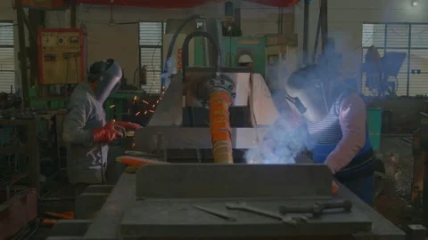 Two worker doing welding work in metal factory Stock Footage 237303654
