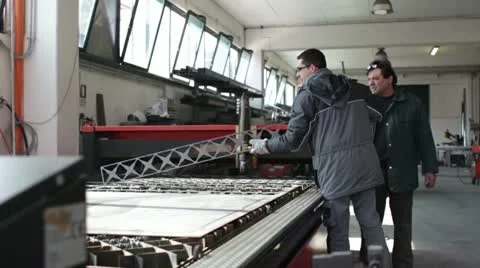 Two worker planning the work in a factory - dolly Stock Footage