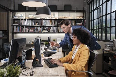 Two workers and colleagues discussed business jobs in workspace office compan Fotos de archivo