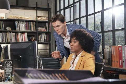 Two workers and colleagues discussed business jobs in workspace office compan Stock Photos