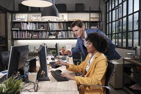 Two workers and colleagues discussed business jobs in workspace office compan Stock Photos