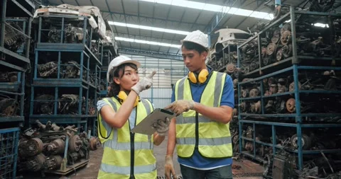 Two workers Asian with safety suit helmet discussion together on process of work Stock Footage 156385118