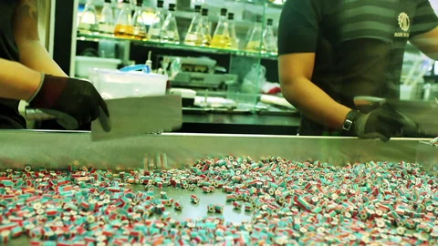 Two workers in a candy factory Stock Footage 247471071