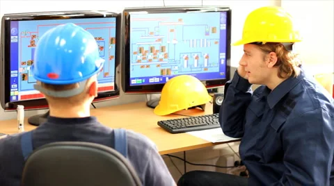 Two workers in control room Stock Footage 1081028