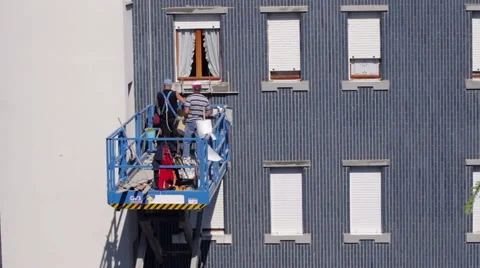 Two workers discuss how to proceed with the restoration of a building Stock Footage 49366569