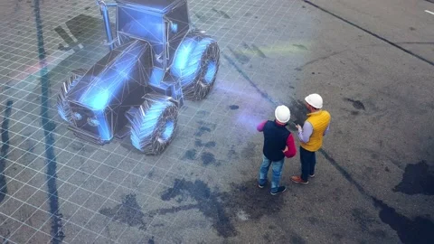 Two workers discuss a project of the new tractor using futuristic hologram Stock Footage 153568713