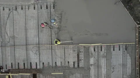Two workers on the foundations of a building Stock Footage 237337794