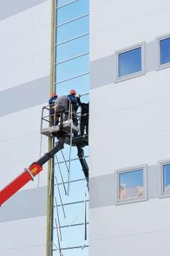 Two workers on the lift platform Stock Photos