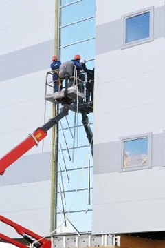 Two workers on the lift platform Stock Photos