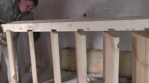 Two workers make wooden staircase Video stock 54930712