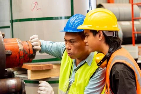 Two workers man talking working in factory Stock Photos