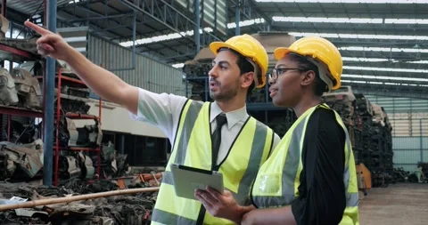 Two workers mechanic discussion by digital tablet computer in factory Stock Footage 156384662