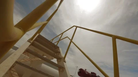 Two Workers Move Up The Stairs Outdoors Stock Footage 62089138