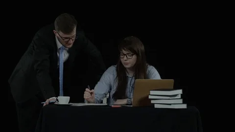 Two workers in the office discuss business plan Stock Footage 77679840
