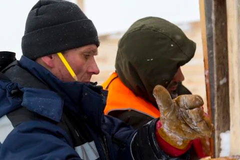 Two workers in overalls at a construction site 스톡 사진