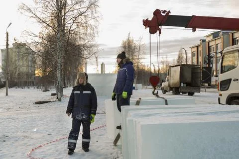 Two workers in overalls at a construction site 写真素材