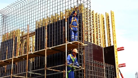 Two workers in overalls perform installation work on forests Stock Footage 73816143
