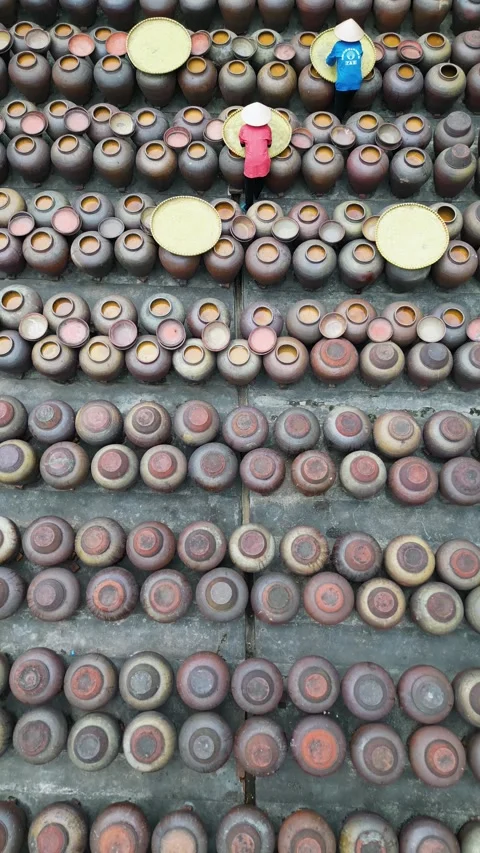 Two workers preparing rice for soy sauce. Vertical video. Stock Footage 300038401