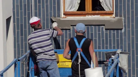 Two workers restoring the window sill of a lift Stock Footage 49449198
