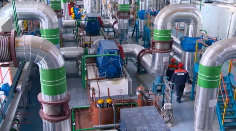 Two Workers in Room With a Complex System of Pipes. Power Station Inside Stock Footage 64640362
