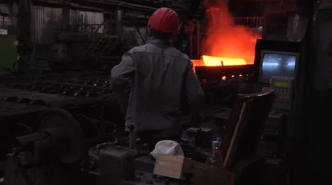 Two Workers in Safety Helmets at The Rollers Metal Rolling Red Hot Metal Sheet Stock Footage 53503772