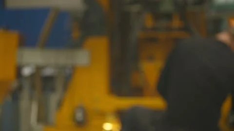 Two workers shake hands at the factory Stock Footage 64795651