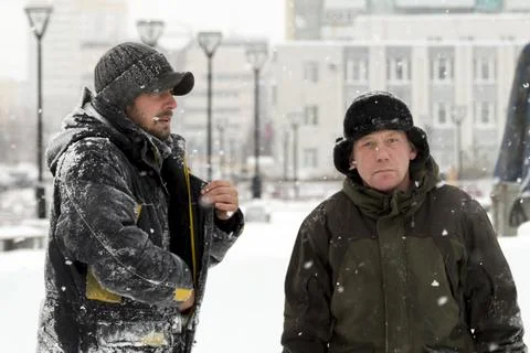 Two workers talk on the assembly site 写真素材