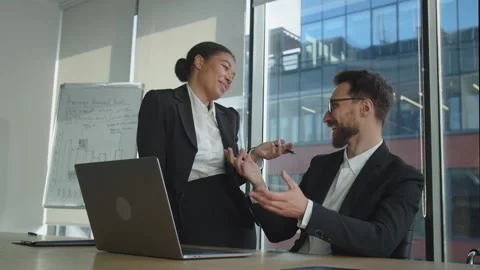 Two workers talk in office. Have good time on work. Discuss normal life and Stock Footage 247416201