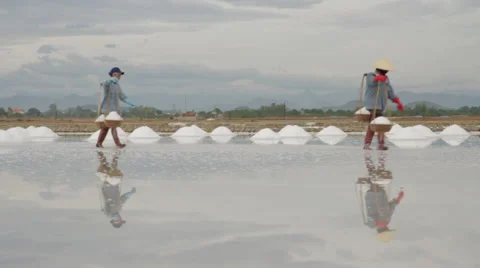 Two Workers Transporting Salt 動画素材 42448602