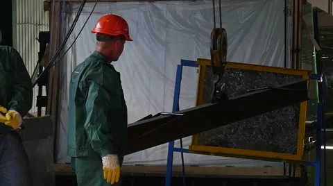 Two Workers in Uniform And Orange Safety Helmets Are Standing at The Tested Stock Footage 53012946