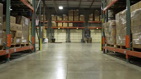 Two workers using forklifts in a warehouse Stock-Footage 83395438
