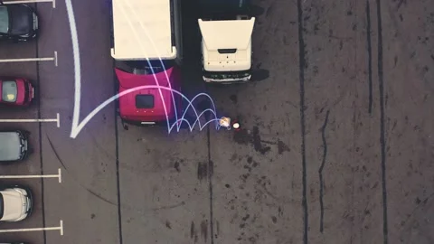 Two workers using tablet stands near trucks. Futuristic technology concept. Stock Footage 153577718