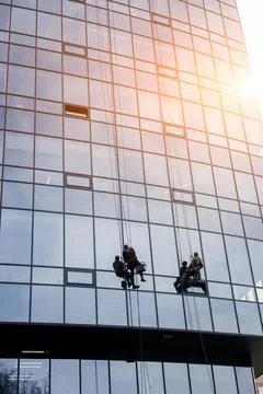 Two workers washing windows Foto stock