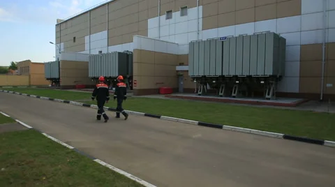 Two workers wearing protective helmet works at electrical power station Video stock 49648043