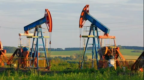 Two working oil pumps Stock Footage